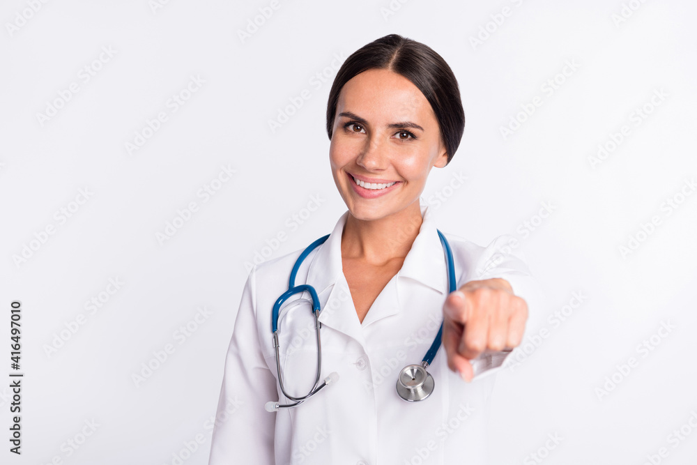 Photo of pretty adorable young woman doctor wear formal coat pointing finger you isolated white color background Photo of pretty adorable young woman doctor wear formal coat pointing finger you isolated white color background