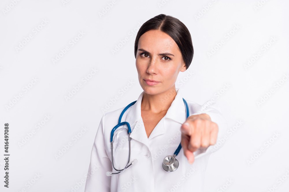 Photo of serious confident young lady medic dressed uniform choosing pointing finger you isolated white color background Photo of serious confident young lady medic dressed uniform choosing pointing finger you isolated white color background