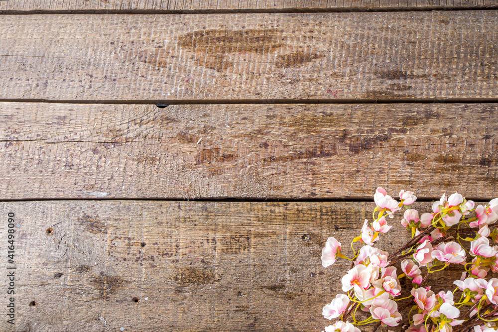 Fototapeta premium Spring flowering branch on wooden background