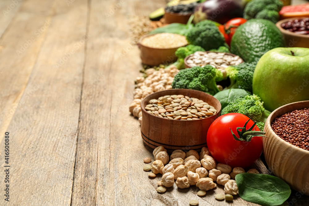 Different vegetables, seeds and fruits on wooden table, space for text. Healthy diet Different vegetables, seeds and fruits on wooden table, space for text. Healthy diet