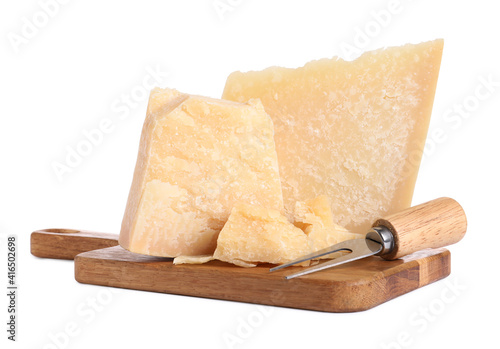 Parmesan cheese with fork and wooden board on white background