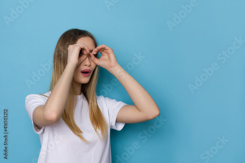 Excited Woman Making Binoculars Hands