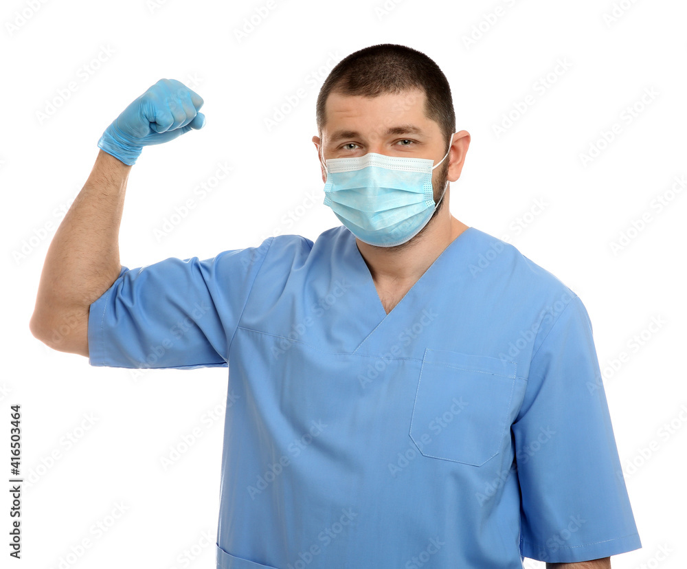 Doctor with protective mask showing muscles on white background. Strong immunity concept Doctor with protective mask showing muscles on white background. Strong immunity concept