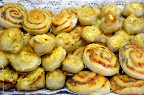 baked mini pizzas with cheese and tomato sauce 
