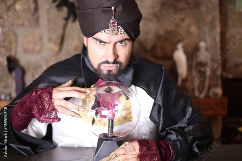Fotografie Soothsayer using crystal ball to predict the future