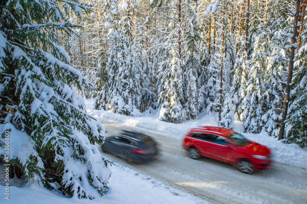 Scenic landscape of winter forest. Trees covered by snow. Car on road. Scenic landscape of winter forest. Trees covered by snow. Car on road.
