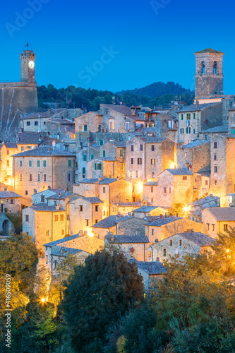 View of old town in the evening night with old tradition buildings and illumination. Sorano, Tuscany, Italy