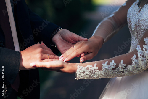 lovers stroking hand with wedding rings