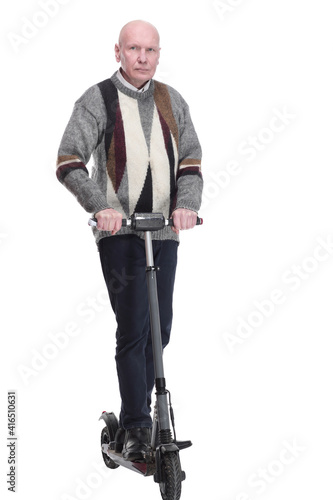 serious mature man with electric scooter. isolated on a white background. © ASDF