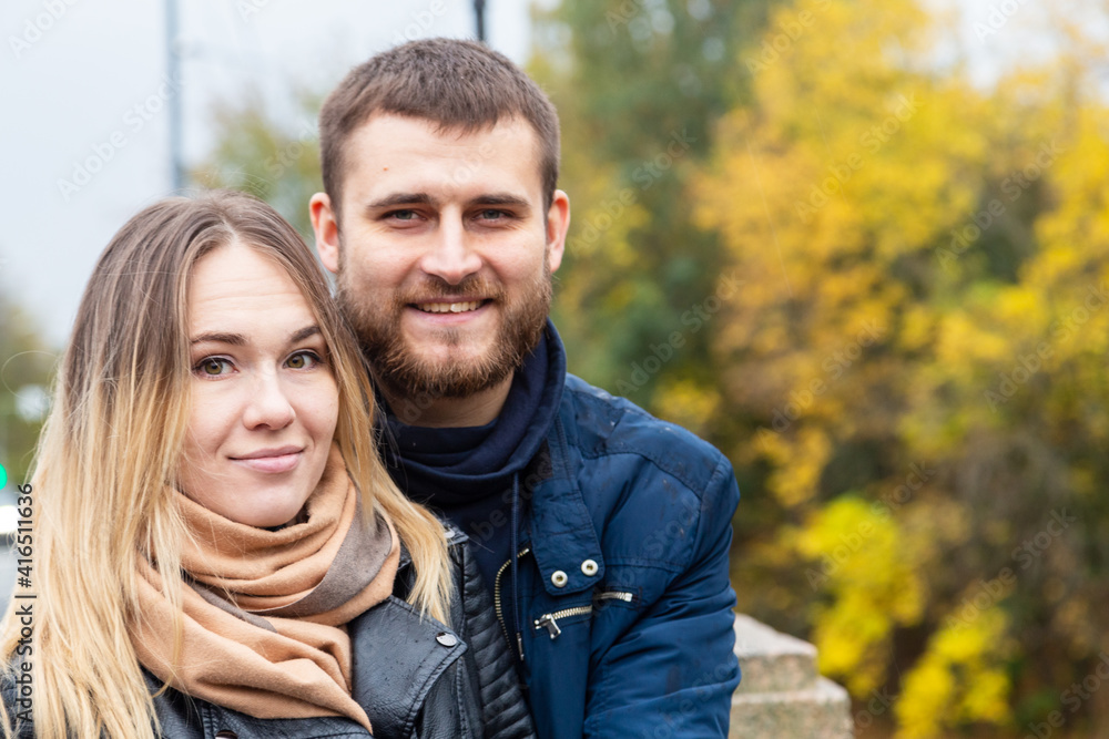 portrait of a couple in autumn park portrait of a couple in autumn park
