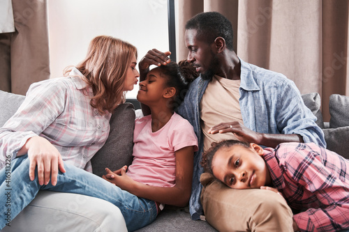 Family with kids laughing and bonding to each other