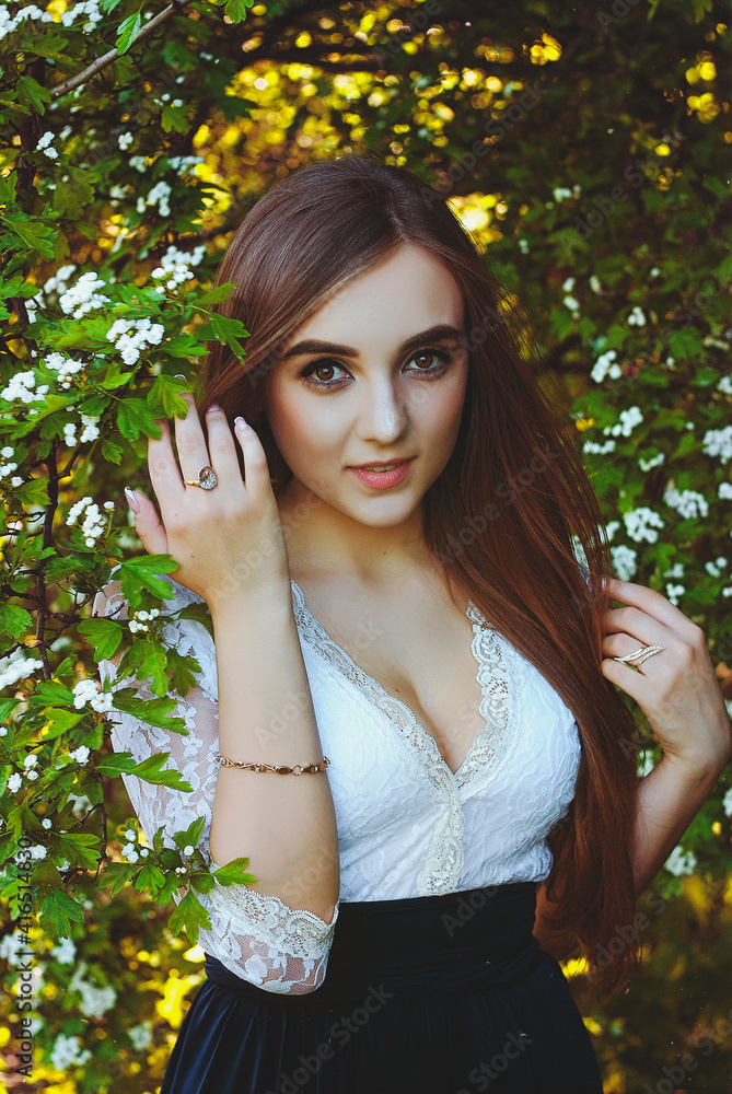 young attractive woman in long dress in spring garden with bouquet of purple lilacs. Sunset light. Spring background. International Woman's Day. Natural beauty. young attractive woman in long dress in spring garden with bouquet of purple lilacs. Sunset light. Spring background. International Woman's Day. Natural beauty.