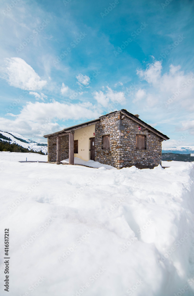 house in the mountains with snow