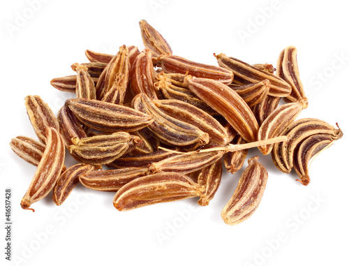 Closeup on a Pile of Caraway Fruit Seed known as Meridian Fennel and Persian Cumin (Carum Carvi). Isolated on White.