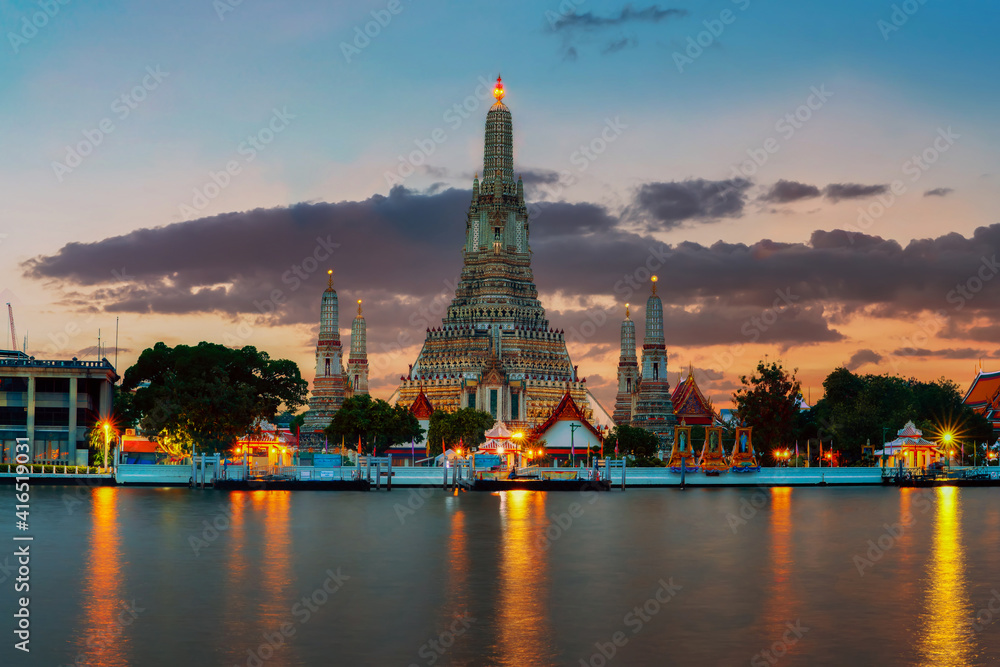 Phra Prang Wat Arun in Thailand, Bangkok famous landmark in Thailand. Landscape of beautiful temple along the Chao Phraya river at twilight.