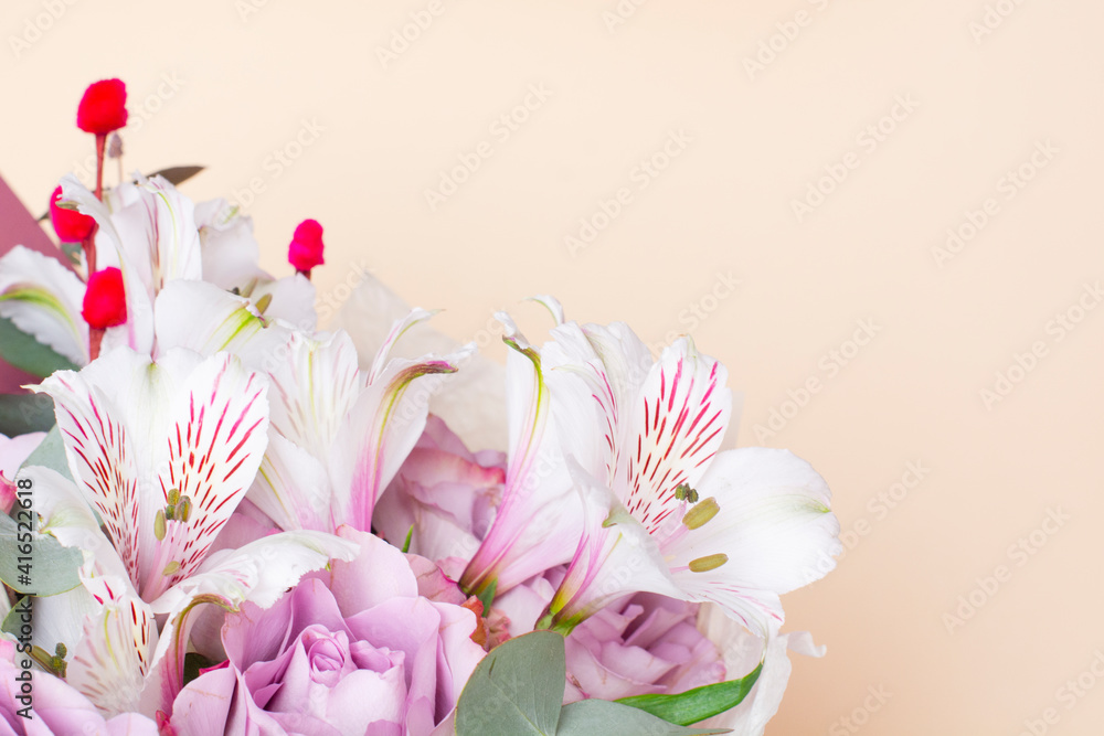 Fototapeta premium beautiful bouquet of Alstroemeria and purple roses. Fresh, lush bouquet of colorful flowers