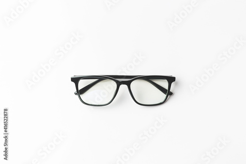 pair of black framed glasses in white background