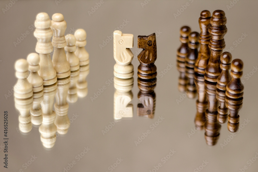 Game of chess. Wooden figures on the mirror. Game of chess. Wooden figures on the mirror.