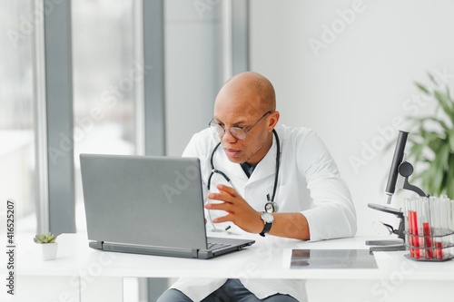 friendly african american doctor in modern office