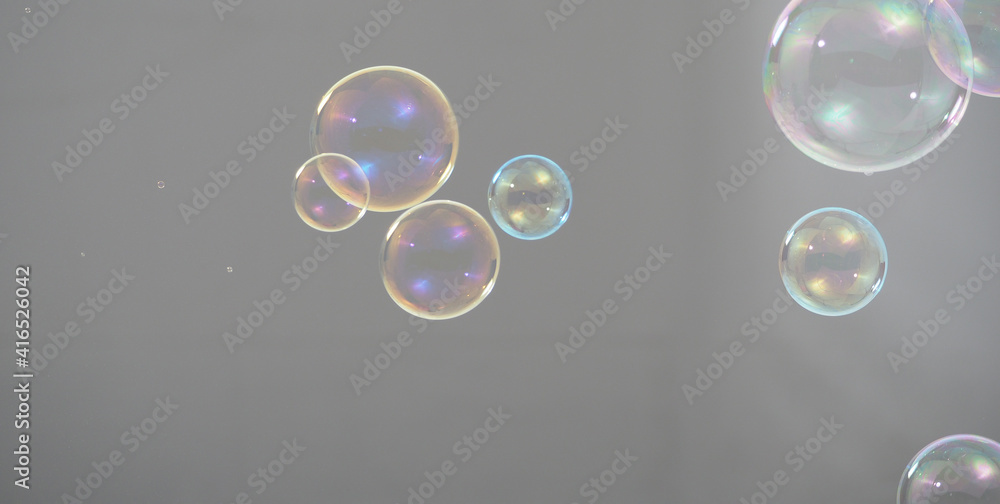 Shampoo bubbles floating like flying in the air by wind blow which represent refreshing playful joyful moments and gentle soft comfortable and look wet soapy for hygiene detergent product industry.