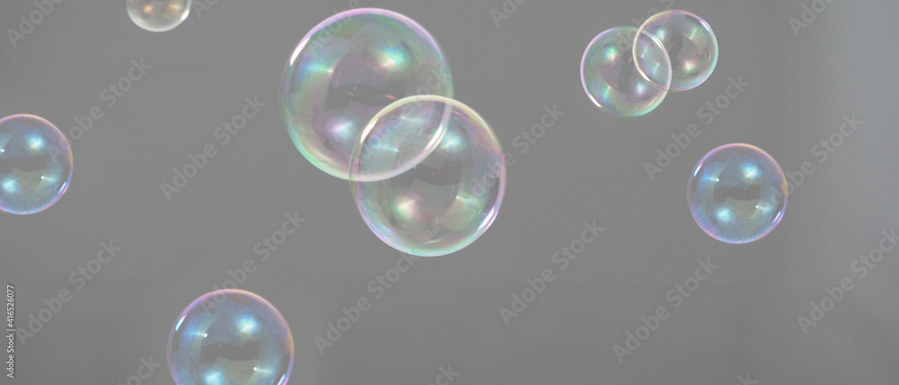 Shampoo bubbles floating like flying in the air by wind blow which represent refreshing playful joyful moments and gentle soft comfortable and look wet soapy for hygiene detergent product industry.