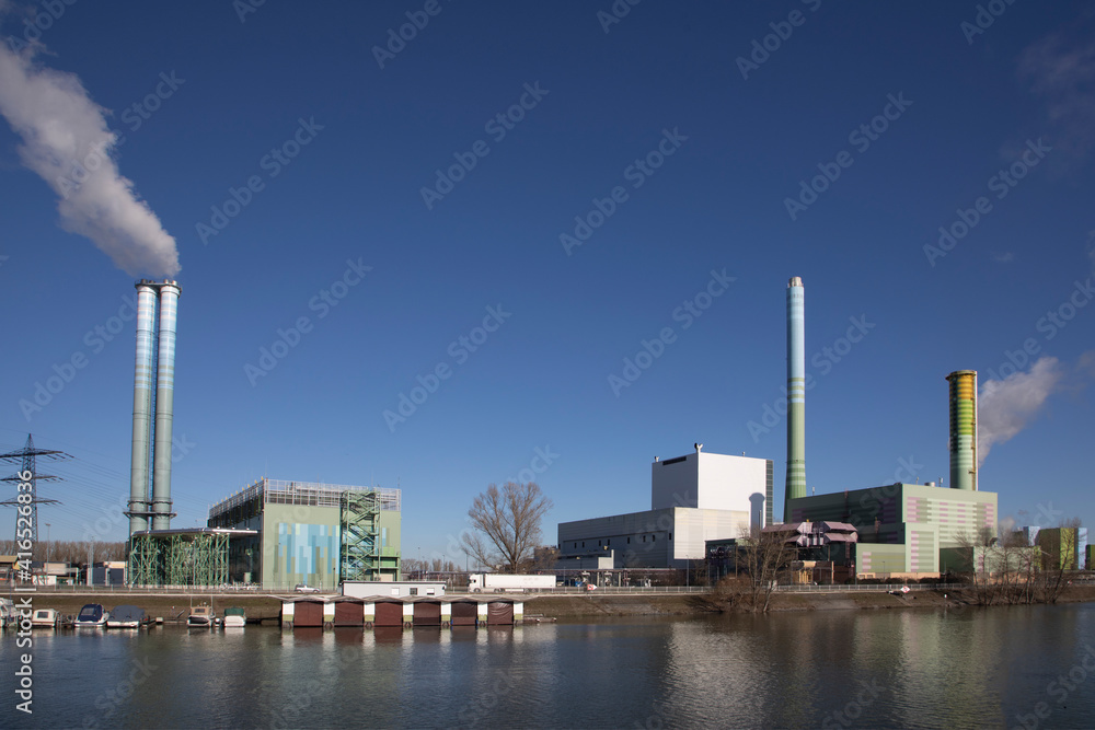 power station industry area with silos and tanks at the rhine harbor in Mainz-Mombach, Germany. power station industry area with silos and tanks at the rhine harbor in Mainz-Mombach, Germany.