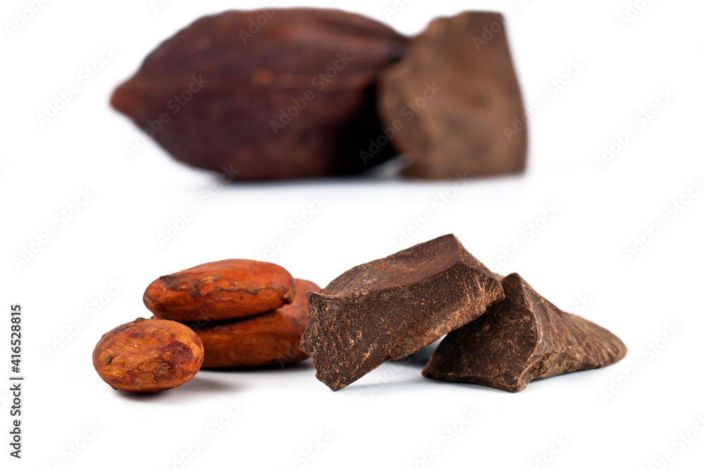 Cocoa pod and cocoa beans with chocolate pieces isolated on a white background. Cocoa pod and cocoa beans with chocolate pieces isolated on a white background.