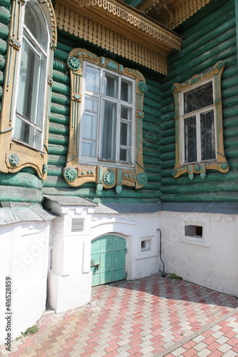 Shorin's wooden house with ornamental carved windows in Gorokhovets town, Vladimir region, Russia. Russian folk and art nouveau style in old vintage architecture. Gorokhovets landmark, monument, sight photo