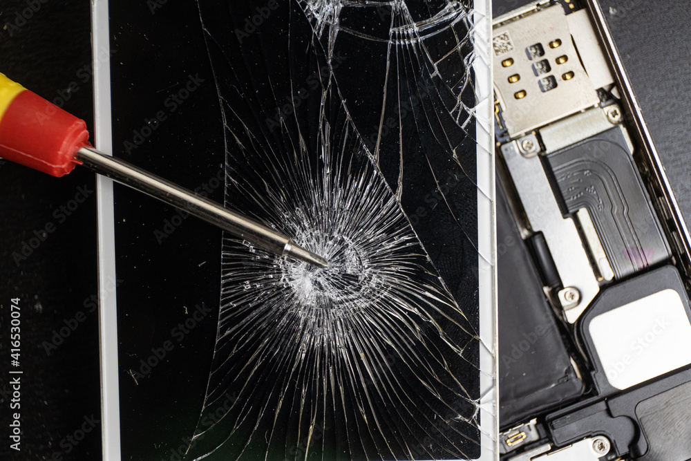 Screen cracked smartphone. Mobile phone with damaged touchscreen ...