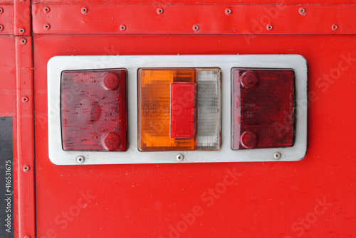 Obraz na plátně Close Up of Tail Lights on Old Red Motor Bus