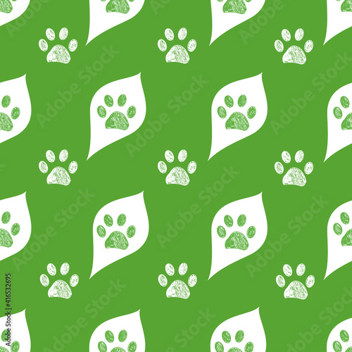 Cute white leaves and doodle paw prints with green background. Fabric design seamless nature pattern