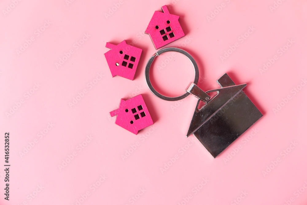 colorful wooden houses on pink , the concept of finance concept