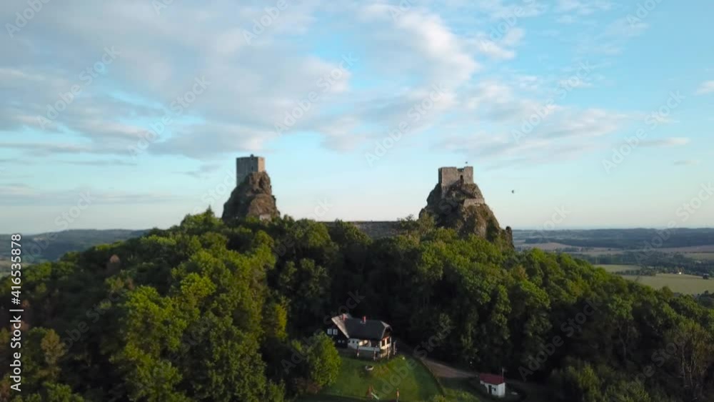 Trosky castle at Bohemian Paradise during a golden hour with balloons in the distance, fly through, 4k or UHD, 30fps Trosky castle at Bohemian Paradise during a golden hour with balloons in the distance, fly through, 4k or UHD, 30fps