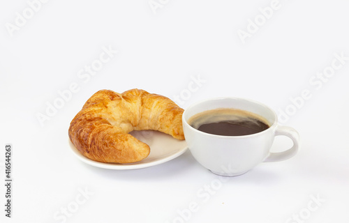 A cup of hot coffee and croissant on white plate isolated on white background with clipping path