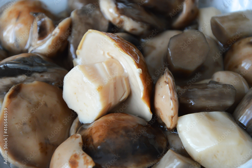 delicious forest pickled mushrooms in a plate. delicious food. background for the design. delicious forest pickled mushrooms in a plate. delicious food. background for the design.