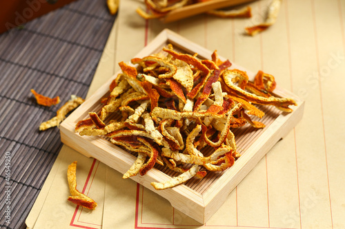 tangerine peel  on a bamboo plate photo