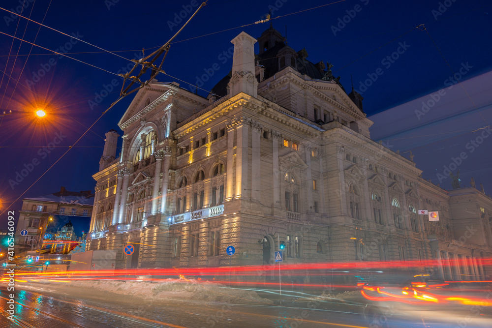 Naklejka premium Night Lviv old city architecture in the winter season. Buildings highlighted by the illumination
