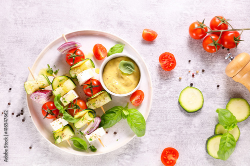 vegetable skewer with courgette, cherry tomato, onion and cheese feta with dipping sauce