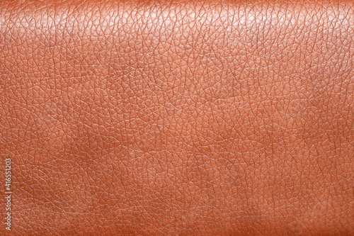 The background of the leather upholstery of the chair is close-up. Leather upholstery texture