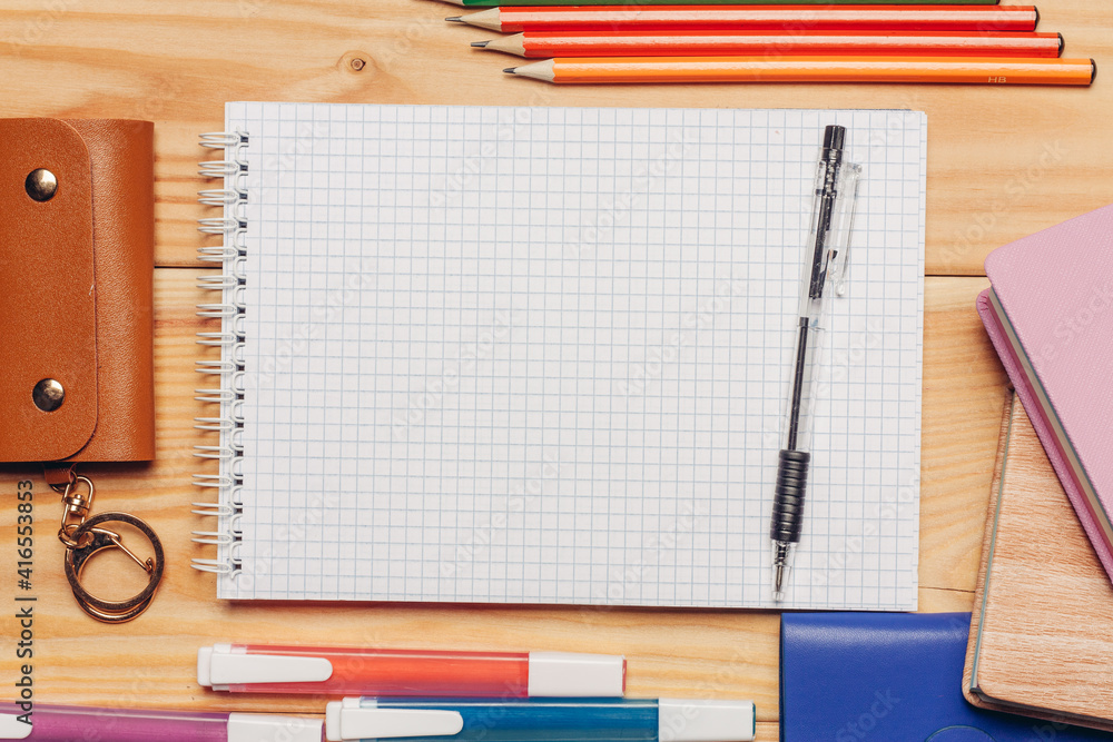 colorful paper notepads felt-tip pens stationery office wooden table colorful paper notepads felt-tip pens stationery office wooden table