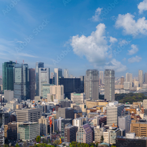 Landscape of tokyo city skyline in Aerial view with skyscraper, modern office building and blue sky background in Tokyo metropolis, Japan.