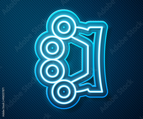 Glowing neon line Brass knuckles icon isolated on blue background. Vector.