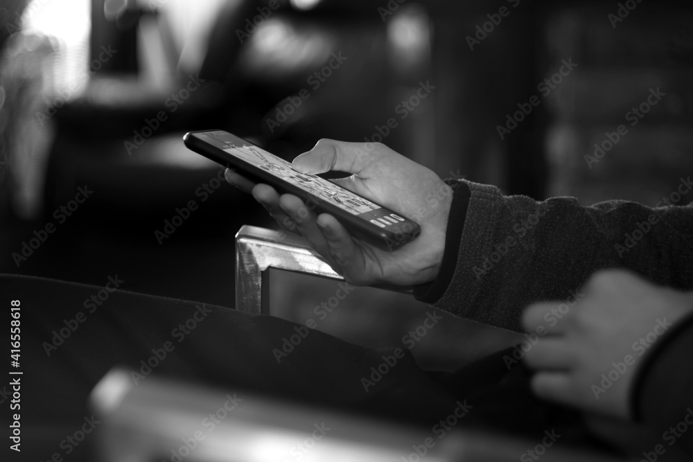 Man holding cell phone in his hands. Selective focus 