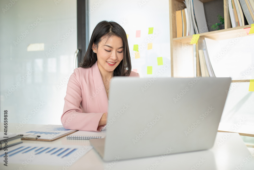 Portrait of Asian woman using computer laptop innovative ideas, in video call conference meetings and work from home. Portrait of Asian woman using computer laptop innovative ideas, in video call conference meetings and work from home.