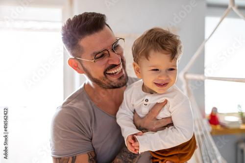 Принти на полотні Father looking after his small son at home