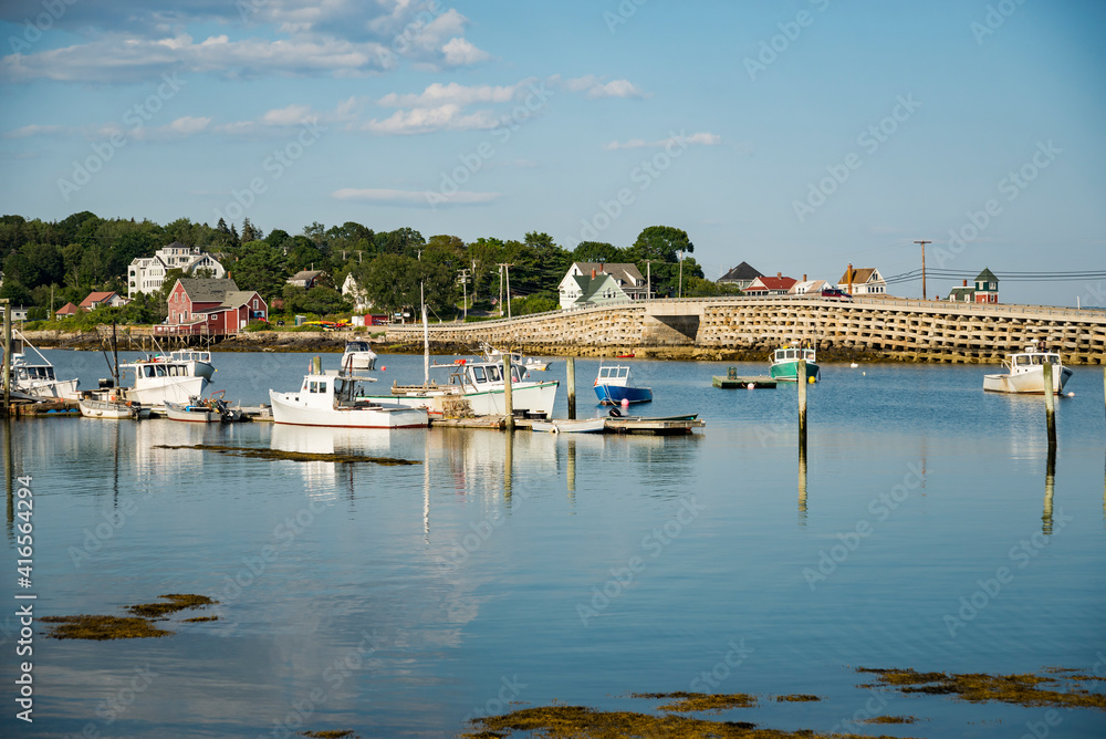 Boats and warehouse on a dock on the Maine coast fishing port