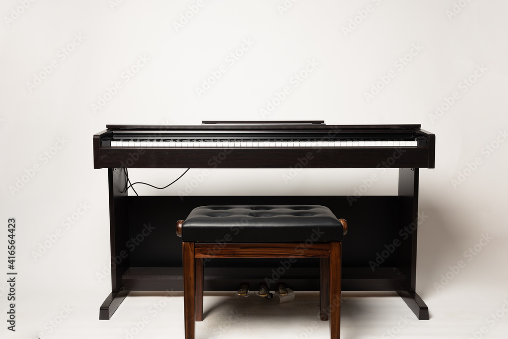 young man playing piano on the white background young man playing piano on the white background
