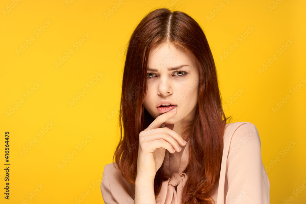 attractive woman posing glamor close-up yellow background attractive woman posing glamor close-up yellow background