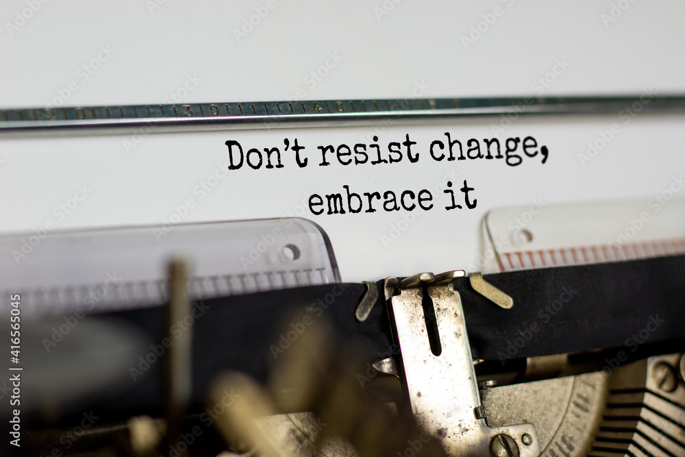 Time to change symbol. Text Do not resist change embrace it typed on retro typewriter. Business and time to change concept. Beautiful background. Copy space. Time to change symbol. Text Do not resist change embrace it typed on retro typewriter. Business and time to change concept. Beautiful background. Copy space.