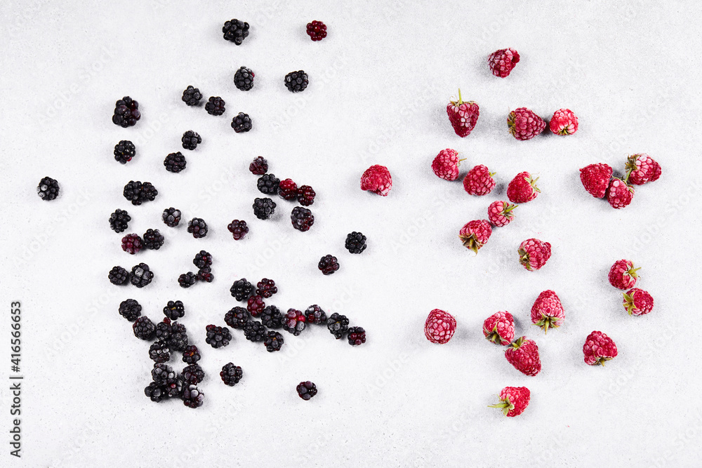 Ripe blackberries and raspberries on the white background Ripe blackberries and raspberries on the white background